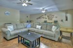 Basement Level Entertainment Area Features Ample Seating, & Gas Fireplace